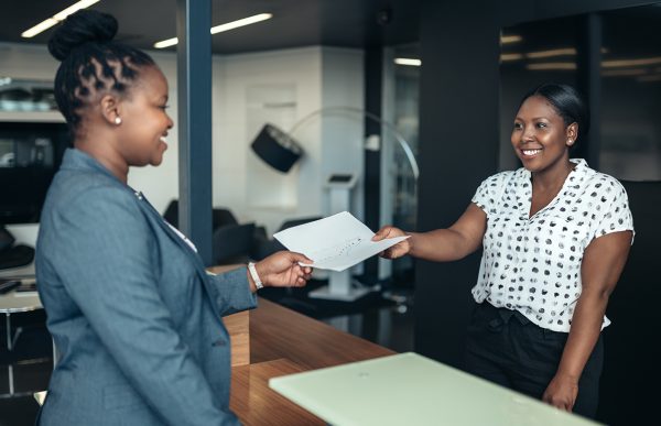 bigstock-Attractive-Black-Receptionist--291557866