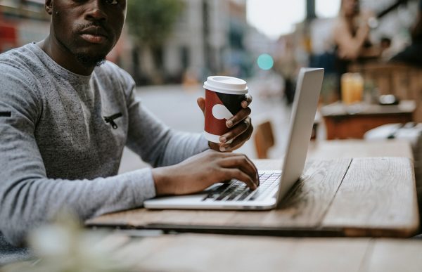 bigstock-Man-working-on-a-laptop-at-a-c-272206534
