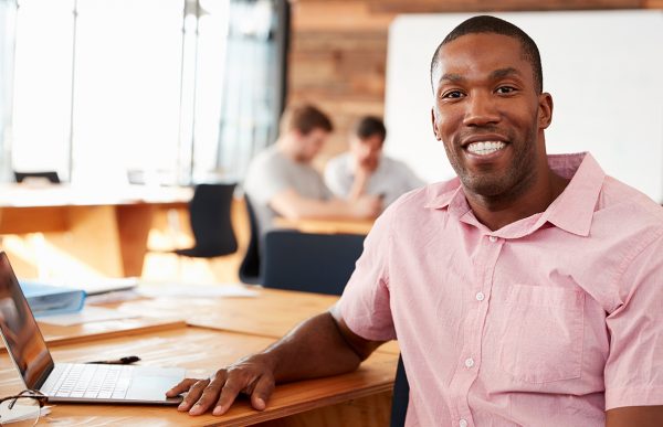 bigstock-Smiling-young-black-man-in-cre-183818269