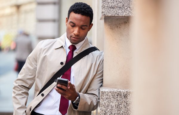 bigstock-Young-black-businessman-leanin-279066538