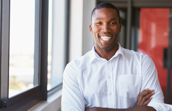 bigstock-Young-black-man-with-arms-cros-183823288