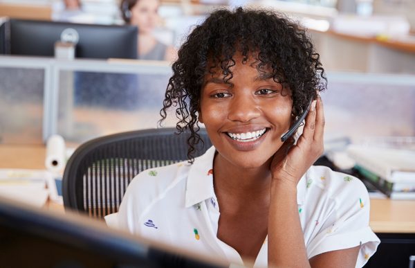 bigstock-Young-black-woman-working-in-a-249333022