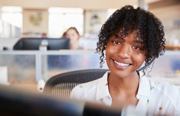 bigstock-Young-black-woman-working-in-a-249333271