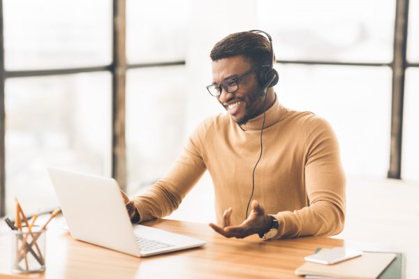 Call Center Service. Smiling Black Customer Support Agent Talkin Call Center Service. Smiling black customer support agent talking with client. Copy space